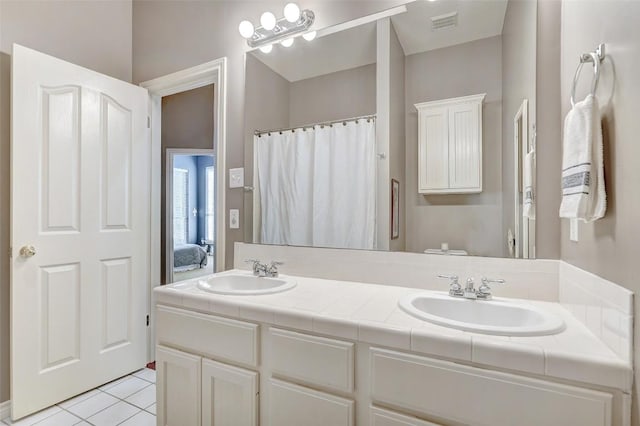 bathroom featuring vanity and tile patterned flooring