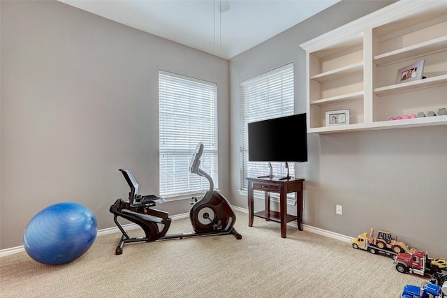 exercise room featuring a healthy amount of sunlight and carpet floors