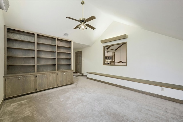 bonus room featuring ceiling fan, lofted ceiling, and light carpet