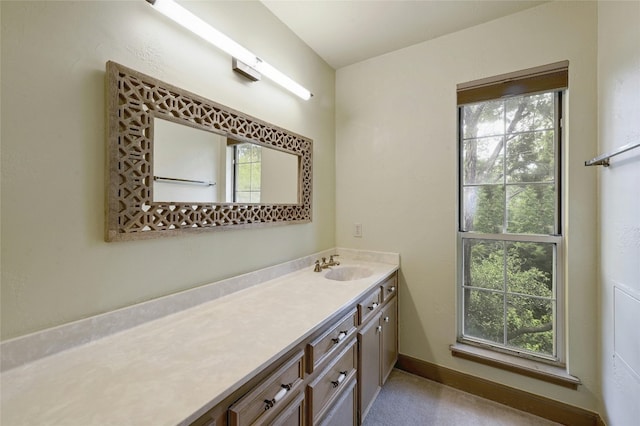 bathroom featuring a healthy amount of sunlight and vanity