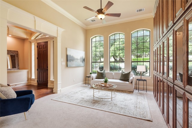 sitting room featuring ornamental molding, ceiling fan, and hardwood / wood-style flooring