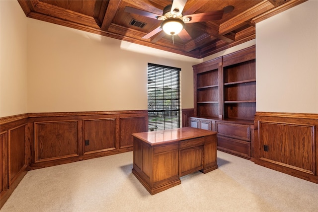 unfurnished office featuring wood ceiling, beam ceiling, coffered ceiling, light carpet, and ceiling fan