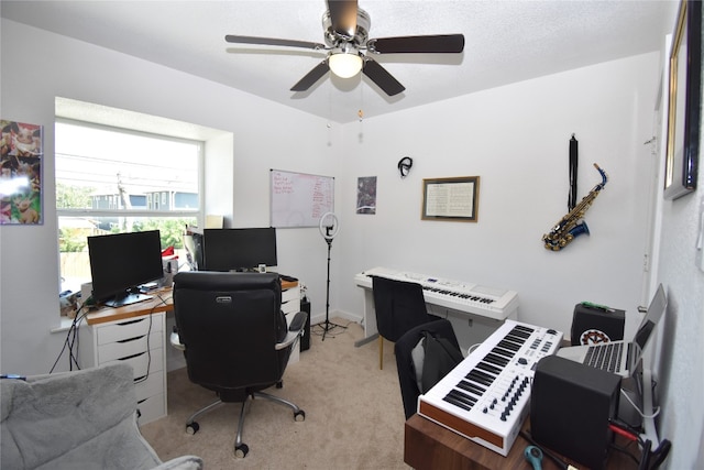 office space with ceiling fan and light colored carpet