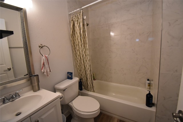 full bathroom featuring shower / tub combo with curtain, vanity, and toilet