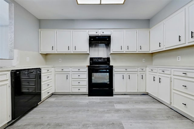 kitchen with light hardwood / wood-style flooring, white cabinets, and black appliances