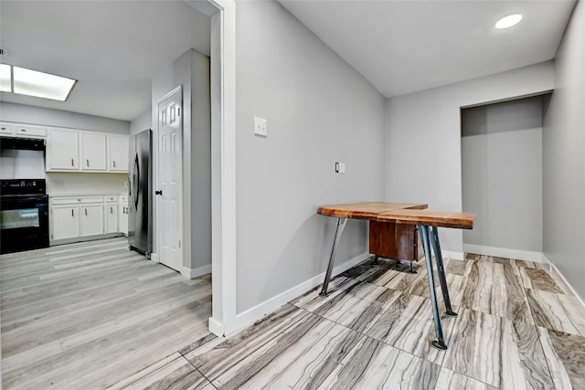 office area with light hardwood / wood-style flooring