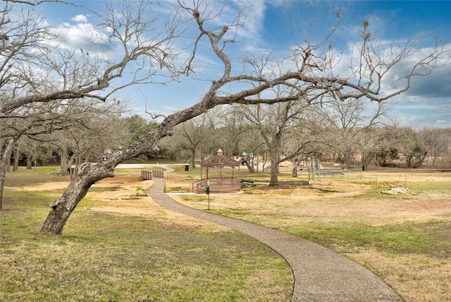 surrounding community with a lawn and a gazebo