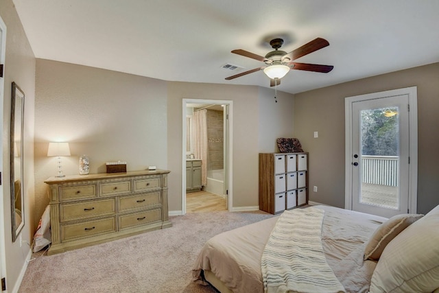 carpeted bedroom with access to outside, connected bathroom, and ceiling fan