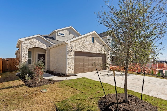 view of front of house with a front lawn and a garage