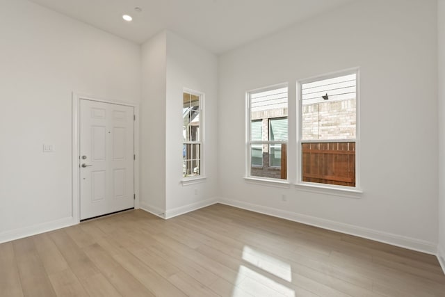 spare room featuring light hardwood / wood-style flooring