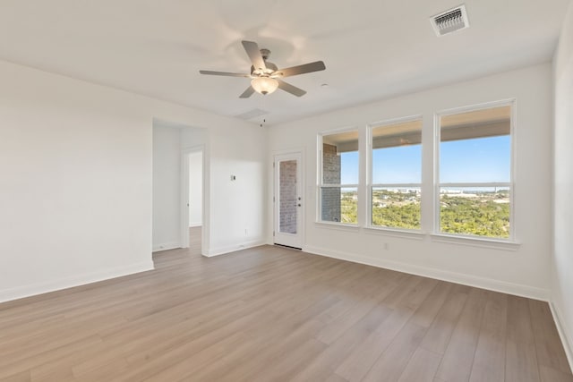 spare room featuring light hardwood / wood-style floors and ceiling fan