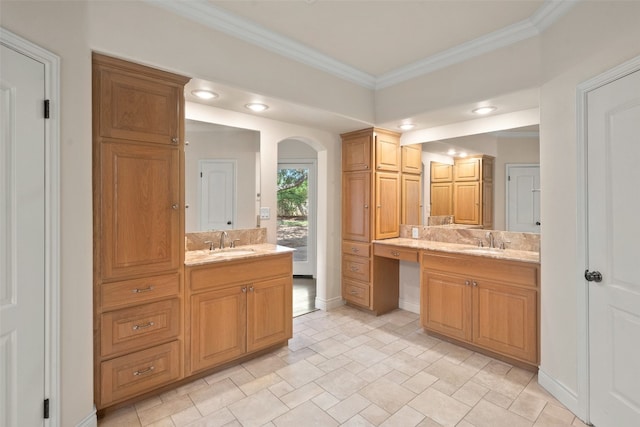 bathroom with ornamental molding, vanity, and decorative backsplash