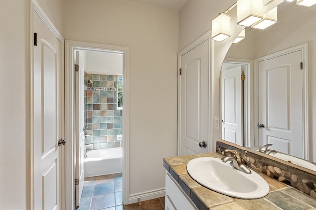 bathroom featuring a bathtub, tile patterned flooring, and vanity