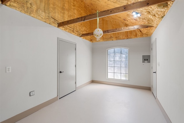 spare room with beam ceiling