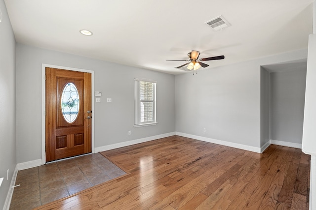 entrance foyer with a wealth of natural light, wood-type flooring, and ceiling fan