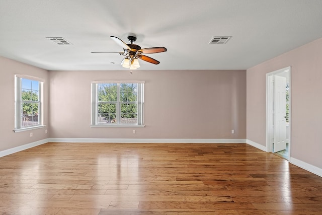 spare room featuring light hardwood / wood-style floors and ceiling fan