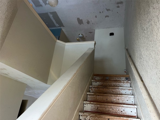 stairs with vaulted ceiling