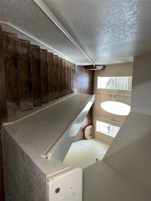 interior space with a textured ceiling and plenty of natural light