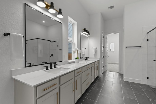 6508 Cowman Way, Austin, TX 78747 - full bath with a shower stall, double vanity, and tile patterned flooring