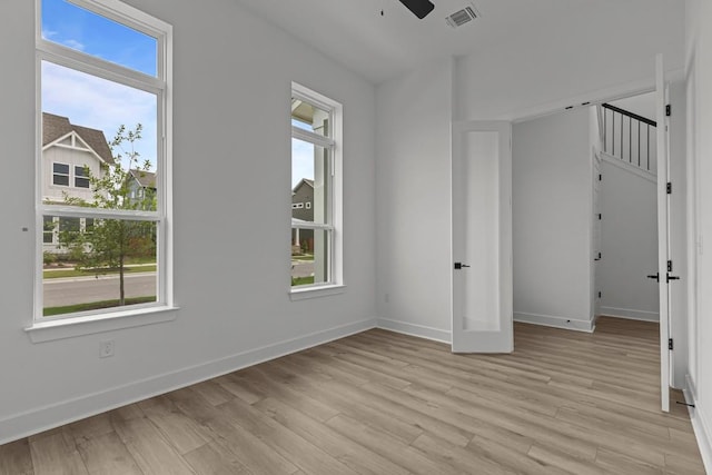 6508 Cowman Way, Austin, TX 78747 - spare room featuring healthy amount of natural light, light wood finished floors, and baseboards