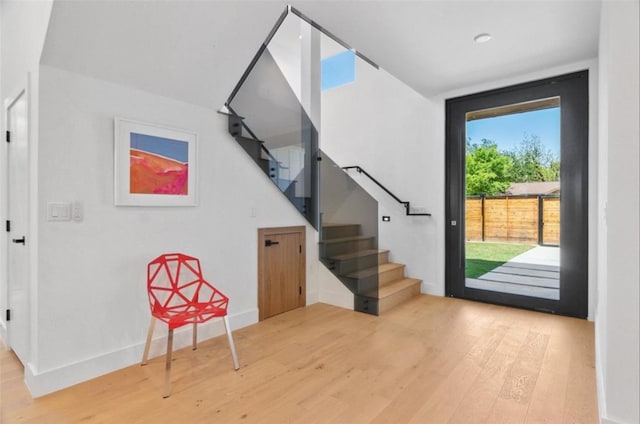 stairway with hardwood / wood-style flooring