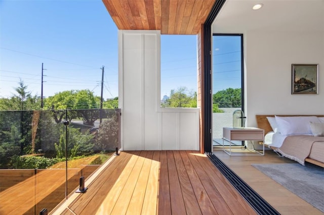 exterior space featuring multiple windows and hardwood / wood-style floors