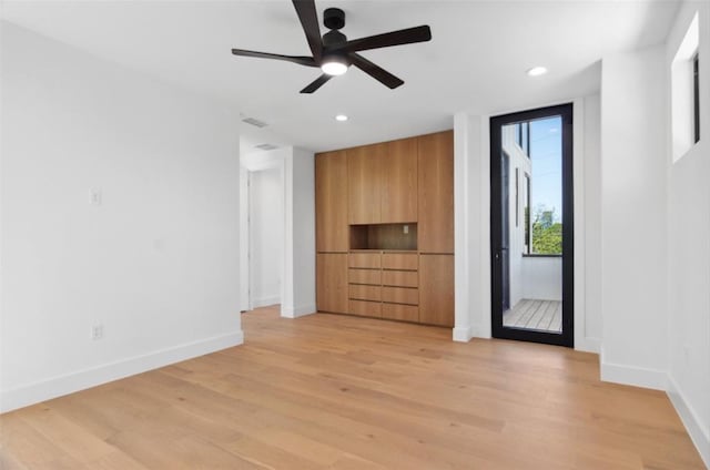 interior space with ceiling fan and light hardwood / wood-style flooring