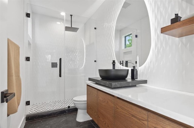 bathroom featuring walk in shower, vanity, and toilet