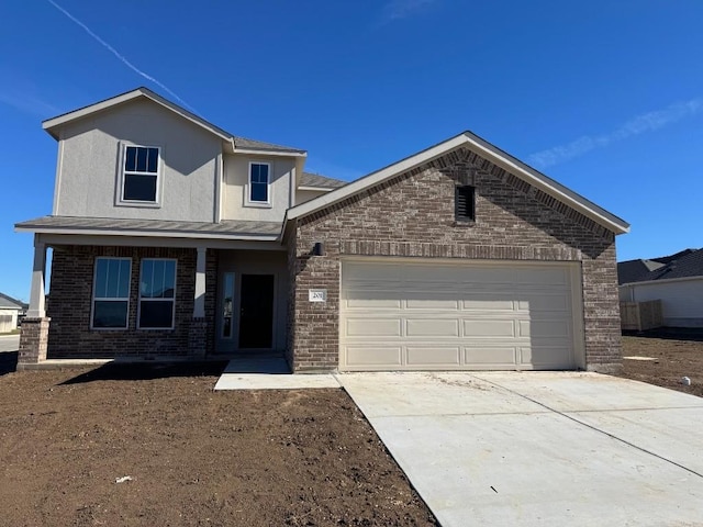 front of property with a garage