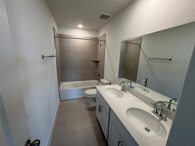 full bathroom with tile patterned flooring, visible vents, and a sink