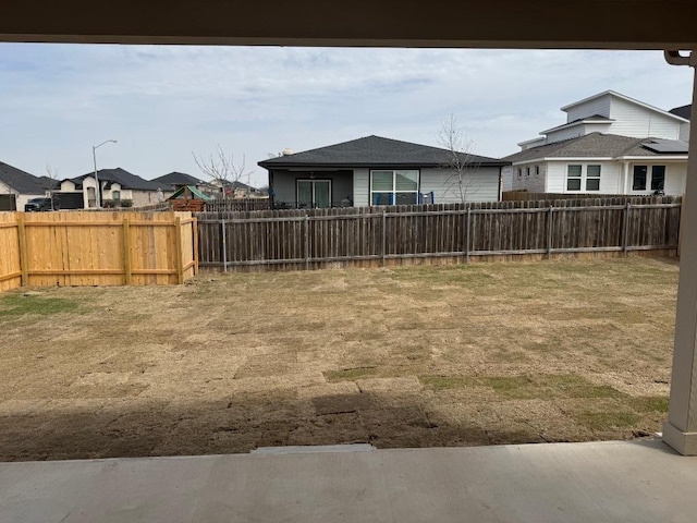 view of yard featuring a fenced backyard