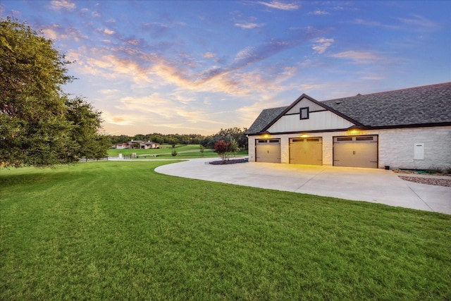 property exterior at dusk featuring a lawn and a garage