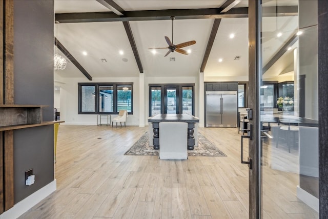 interior space with light wood-type flooring, beamed ceiling, high vaulted ceiling, ceiling fan, and french doors