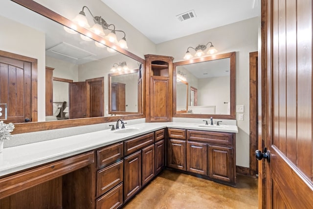 bathroom with vanity and concrete flooring