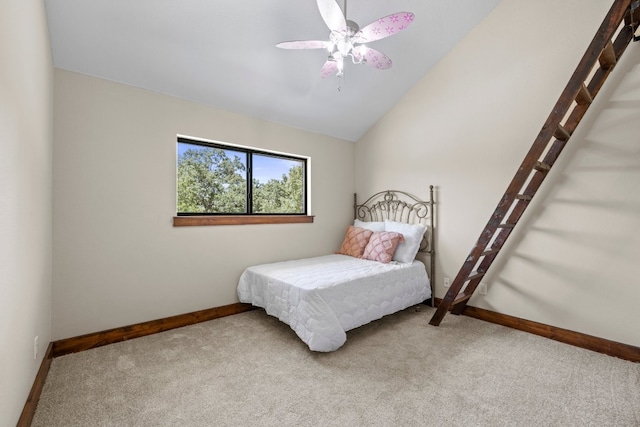 carpeted bedroom with ceiling fan and lofted ceiling