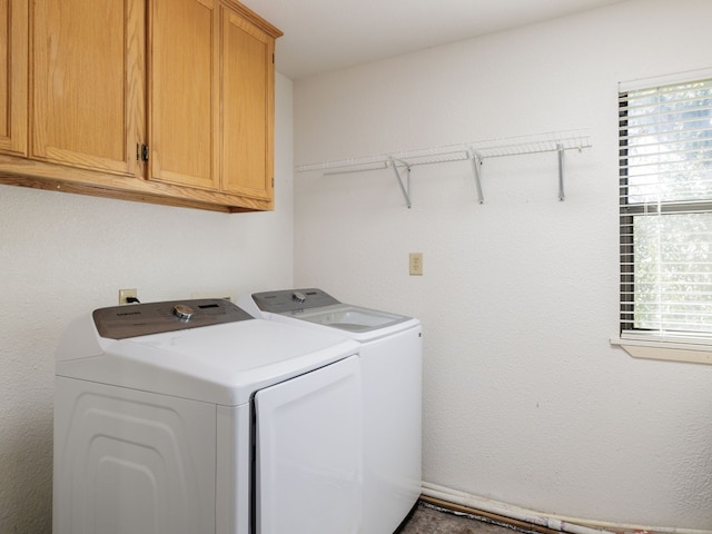 laundry area featuring cabinets and independent washer and dryer