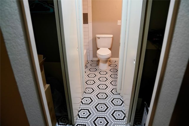 bathroom with a shower and toilet