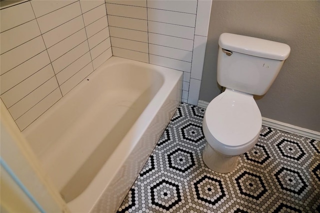 bathroom with toilet and a bathing tub