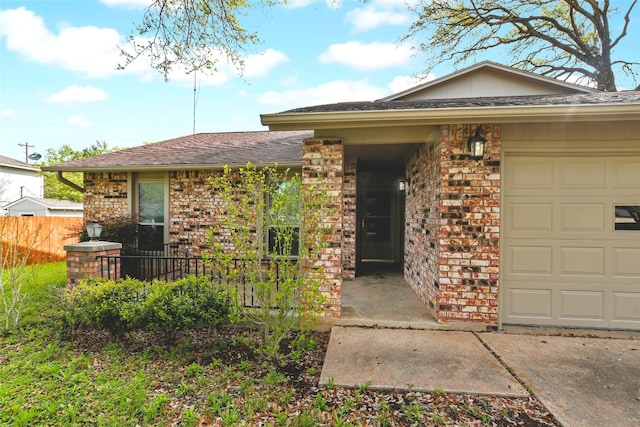 ranch-style home featuring a garage