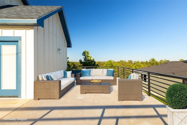 view of patio / terrace with a balcony and an outdoor hangout area