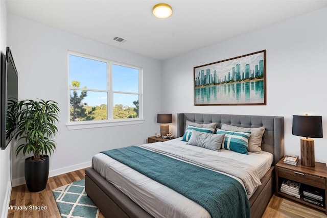 bedroom featuring wood-type flooring