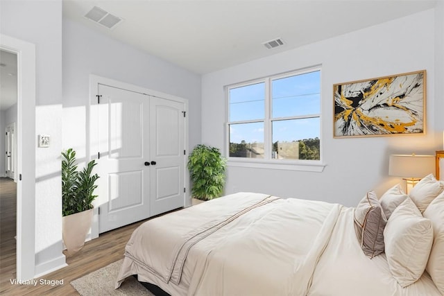 bedroom featuring hardwood / wood-style flooring and a closet