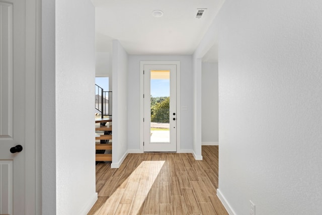 doorway to outside featuring light hardwood / wood-style flooring