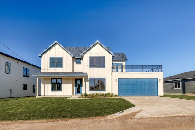 modern farmhouse featuring roof with shingles, board and batten siding, a garage, driveway, and a front lawn