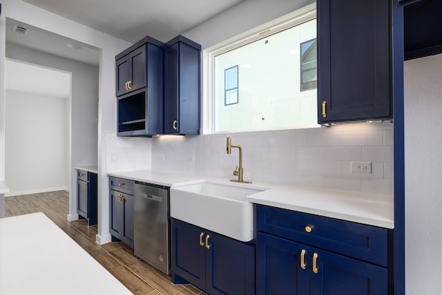 kitchen featuring dark hardwood / wood-style flooring, tasteful backsplash, stainless steel dishwasher, and sink