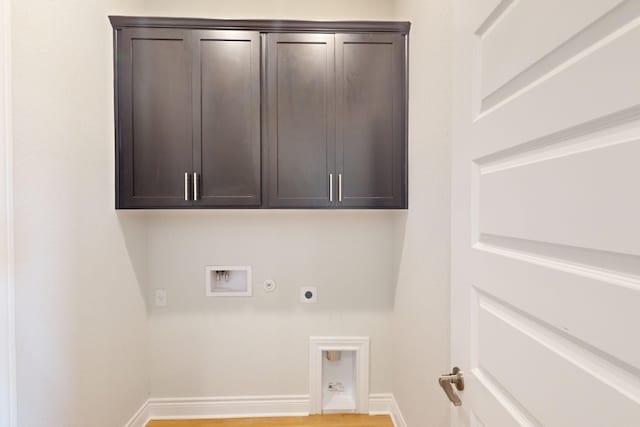 laundry area with electric dryer hookup, cabinets, gas dryer hookup, and hookup for a washing machine