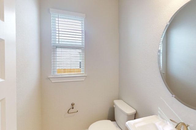 bathroom featuring sink and toilet