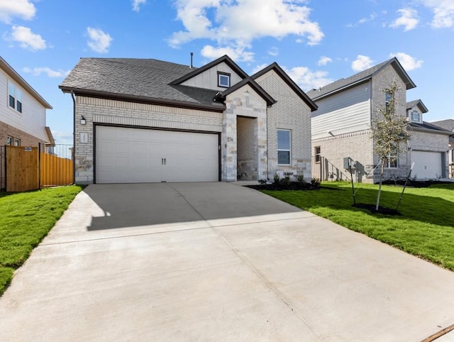 view of front facade featuring a front lawn and a garage