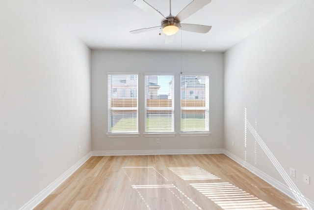 spare room featuring ceiling fan and light wood-type flooring