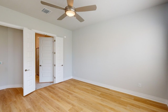 unfurnished bedroom with hardwood / wood-style flooring and ceiling fan